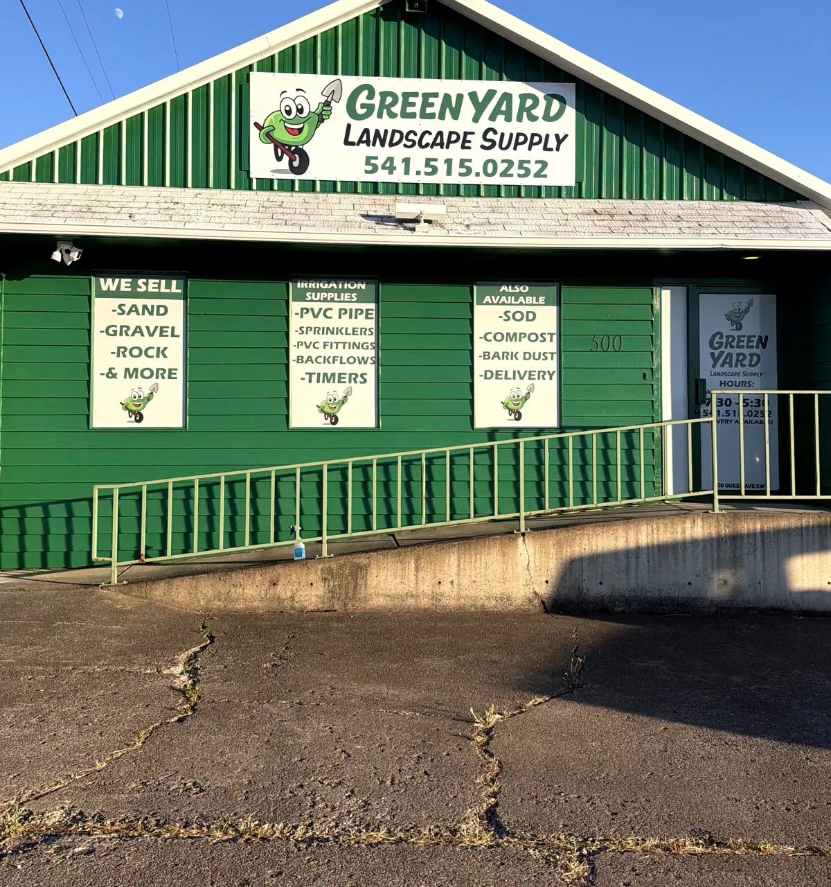 The front of the Green Yard building with its window signs